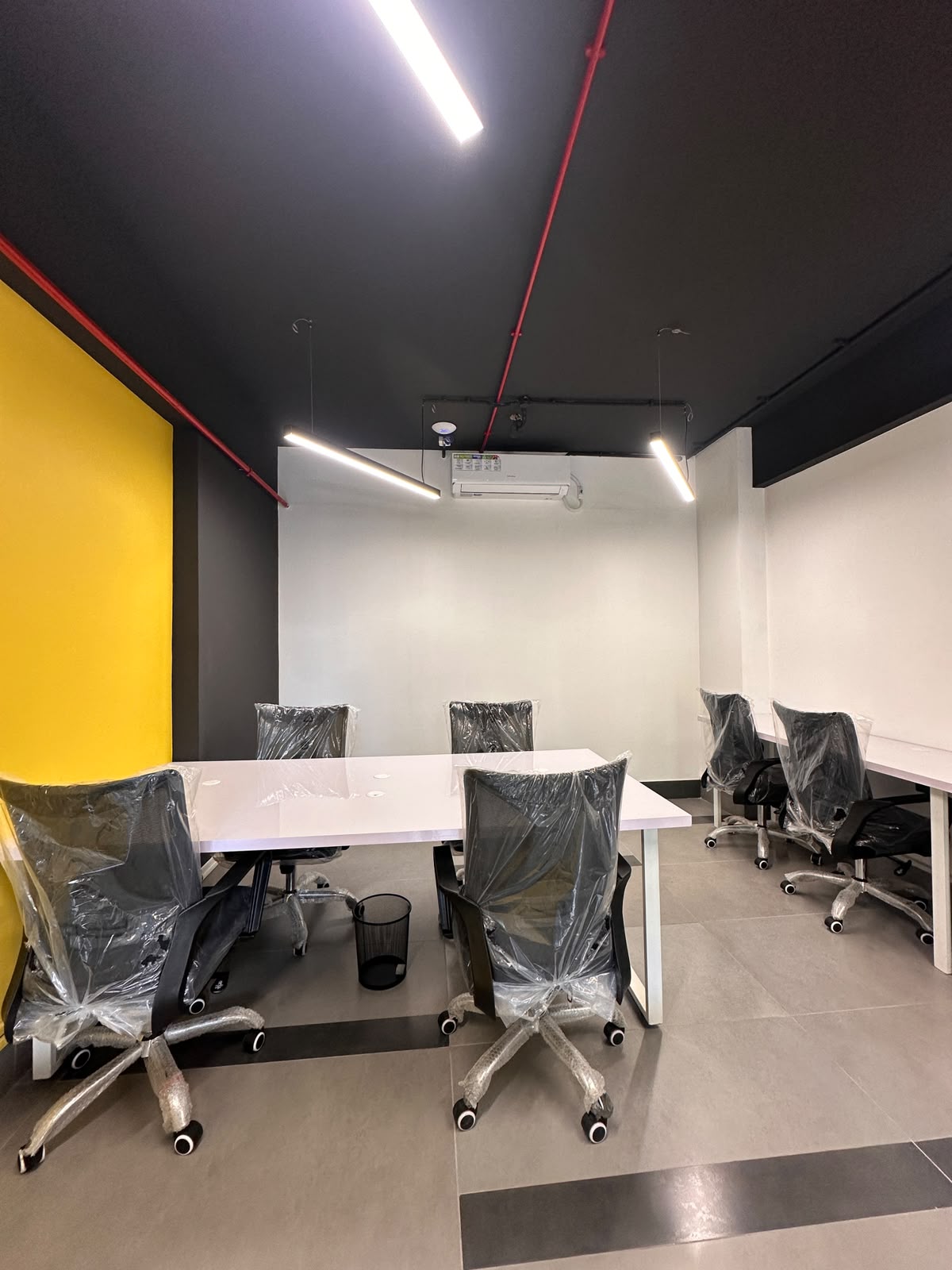 Private team room with conference desk at WorkMore, The Pavilion