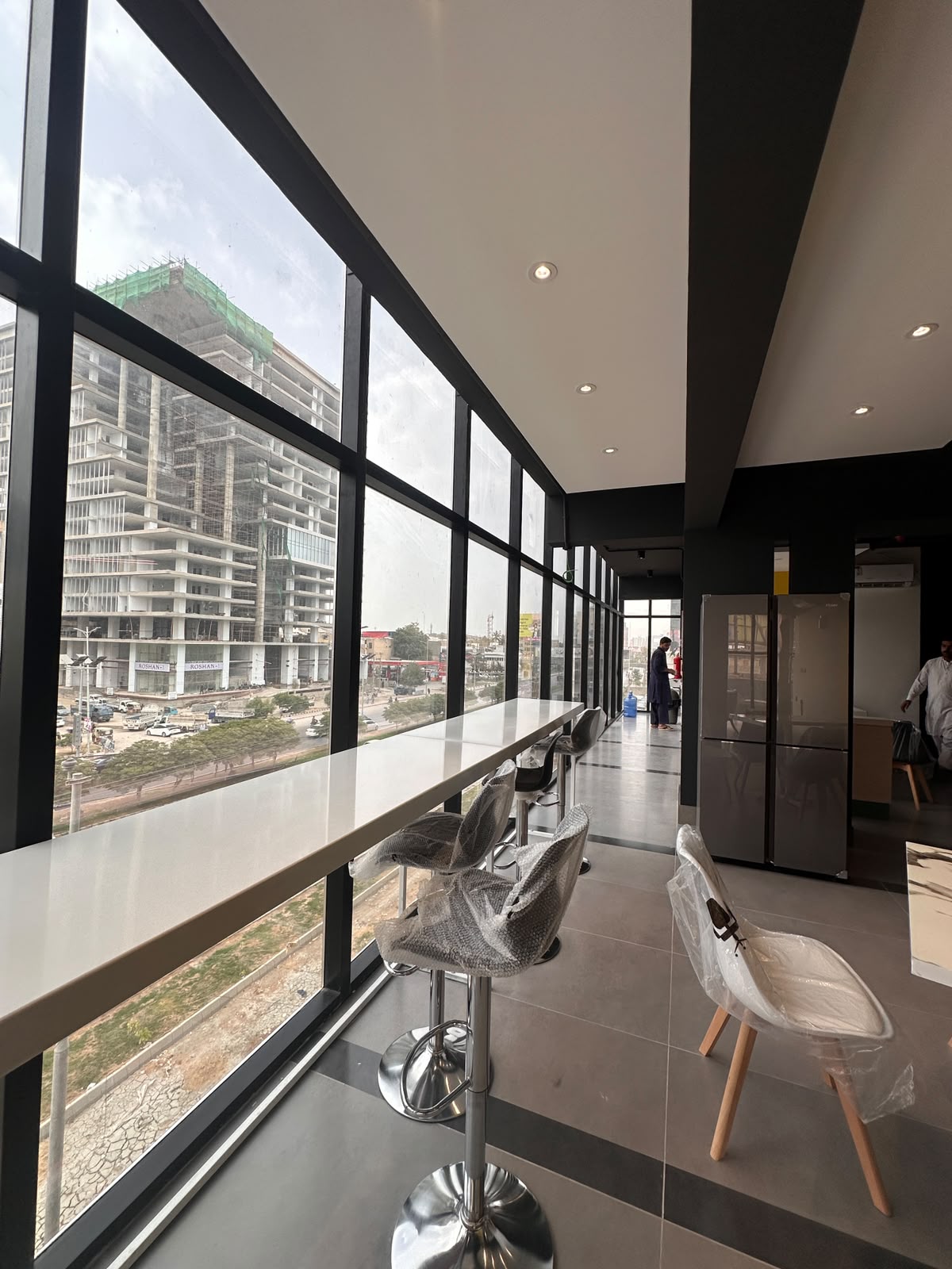 City-view bar seating beside the pantry at WorkMore, The Pavilion